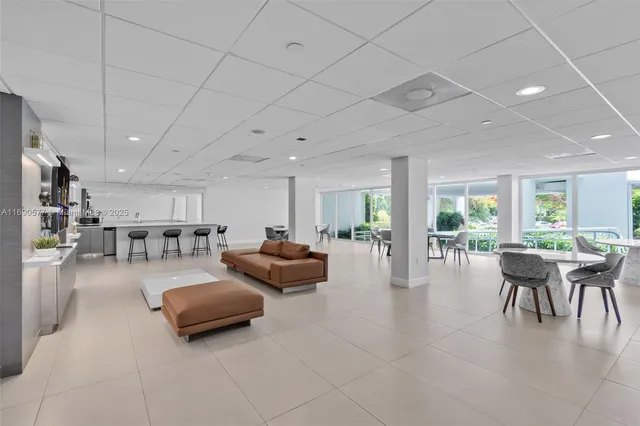 a dining room with furniture a table and chairs