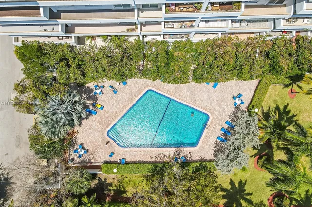 a view of swimming pool from a balcony