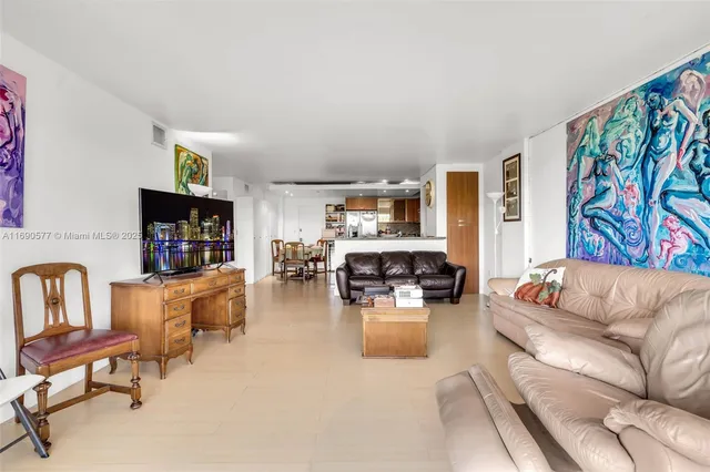 a living room with fireplace furniture and flat screen tv