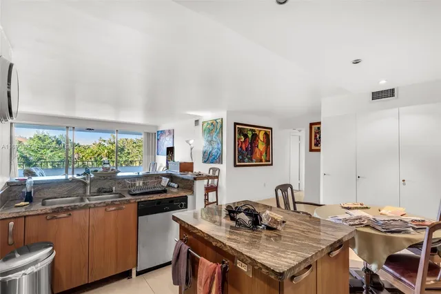 a kitchen with a table chairs and a stove
