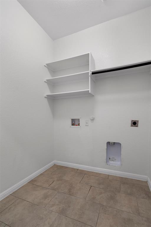 236 Prato Place Georgetown, TX 78628 - Photo 25 of 40 Functional laundry space featuring ample shelving and a convenient hanging rod.