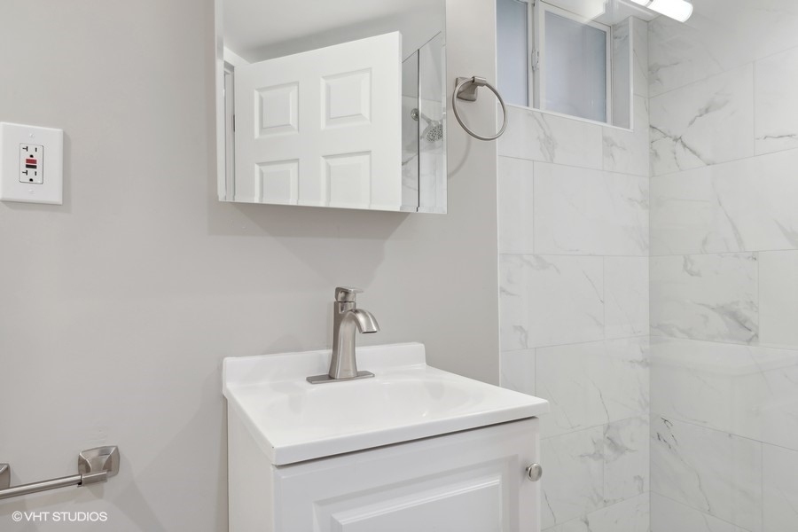2490 Green Bay Road Highland Park, IL 60035 - Photo 17 of 29 a bathroom with a sink and a mirror