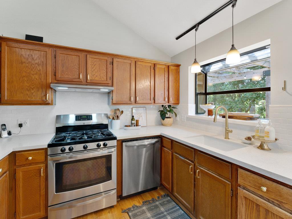 153 Browns Valley Road Corralitos, CA 95076 - Photo 5 of 40 a kitchen with stainless steel appliances a stove sink and cabinets
