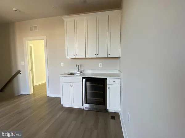 a view of a kitchen with dishwasher and a stove top oven