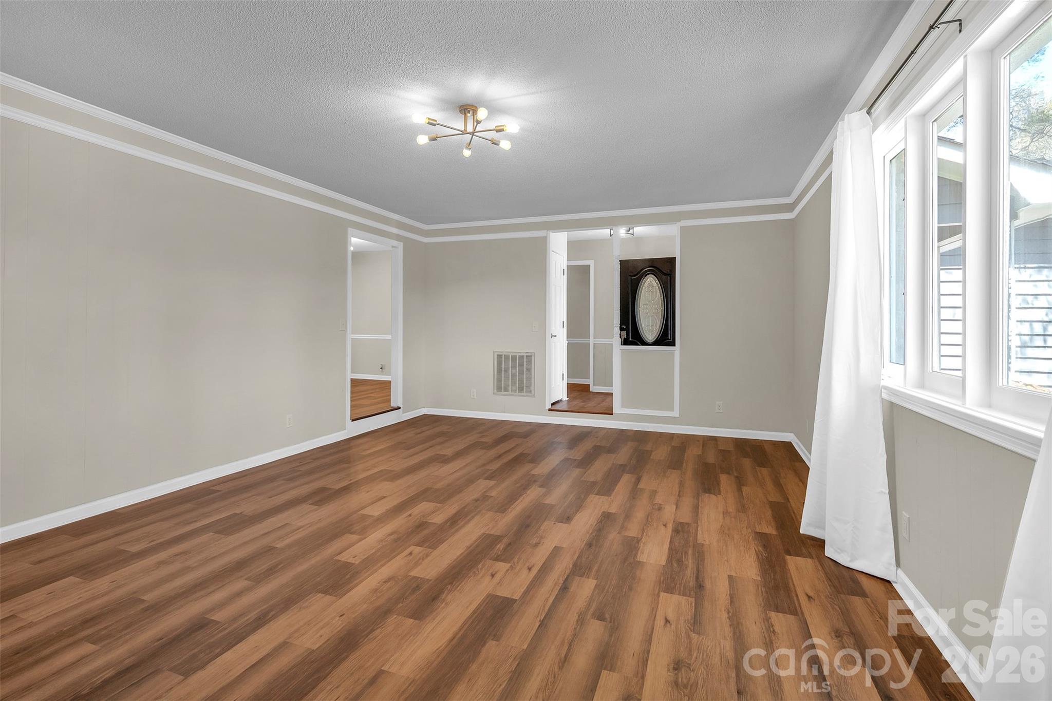1471 Monroe Highway Lancaster, SC 29720 - Photo 12 of 45 a view of empty room with wooden floor and fan