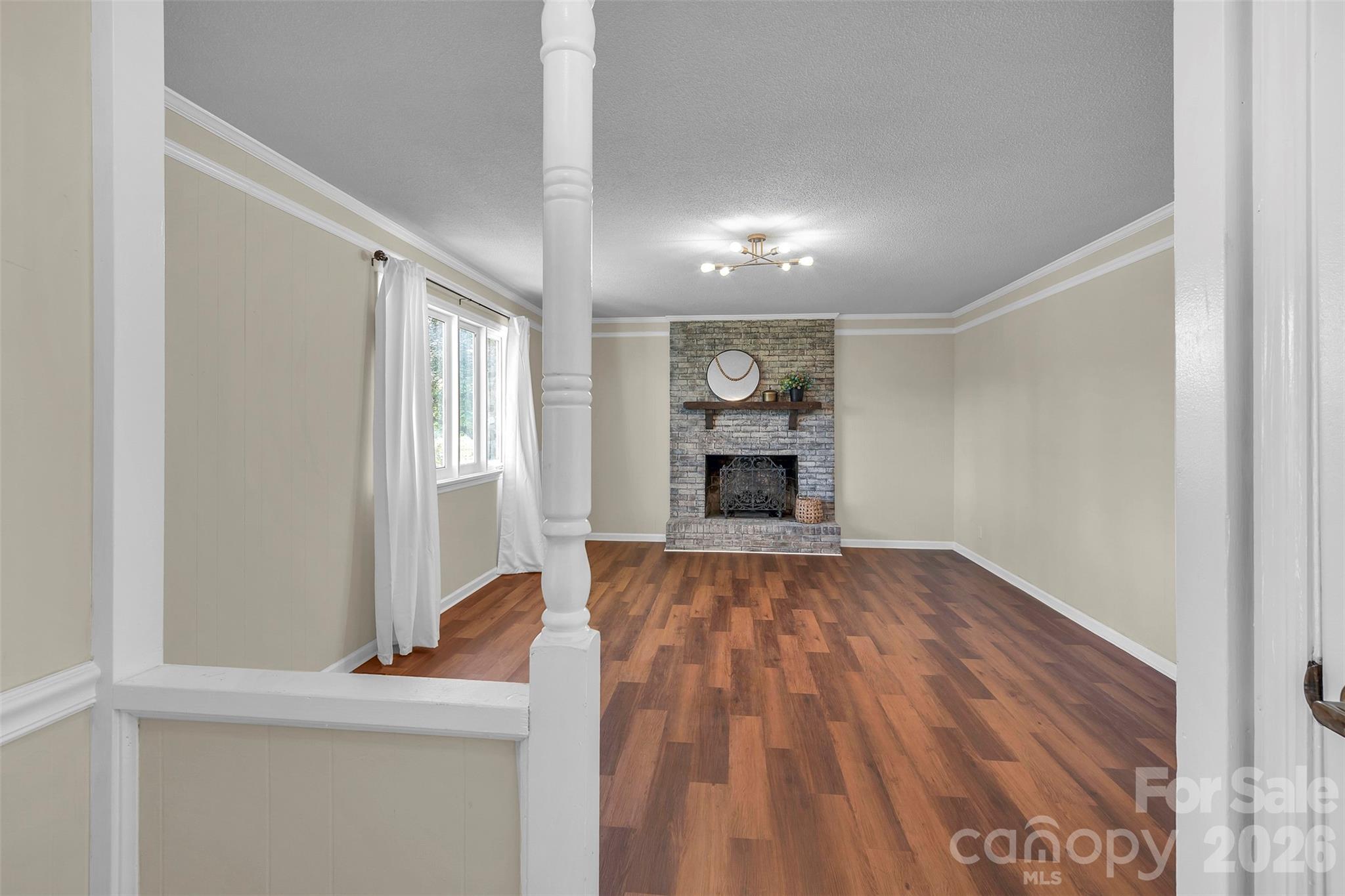 1471 Monroe Highway Lancaster, SC 29720 - Photo 13 of 45 a view of empty room with wooden floor and fireplace