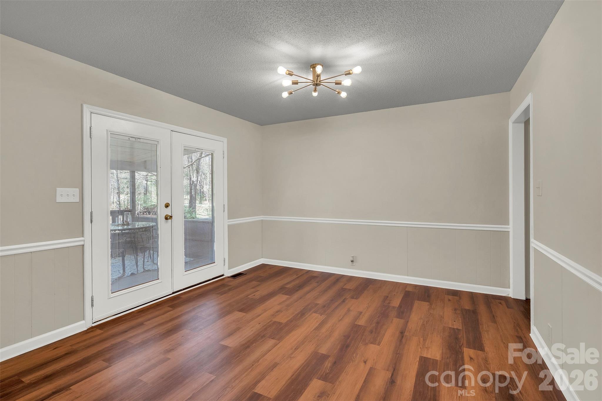 1471 Monroe Highway Lancaster, SC 29720 - Photo 15 of 45 wooden floor in an empty room with a window