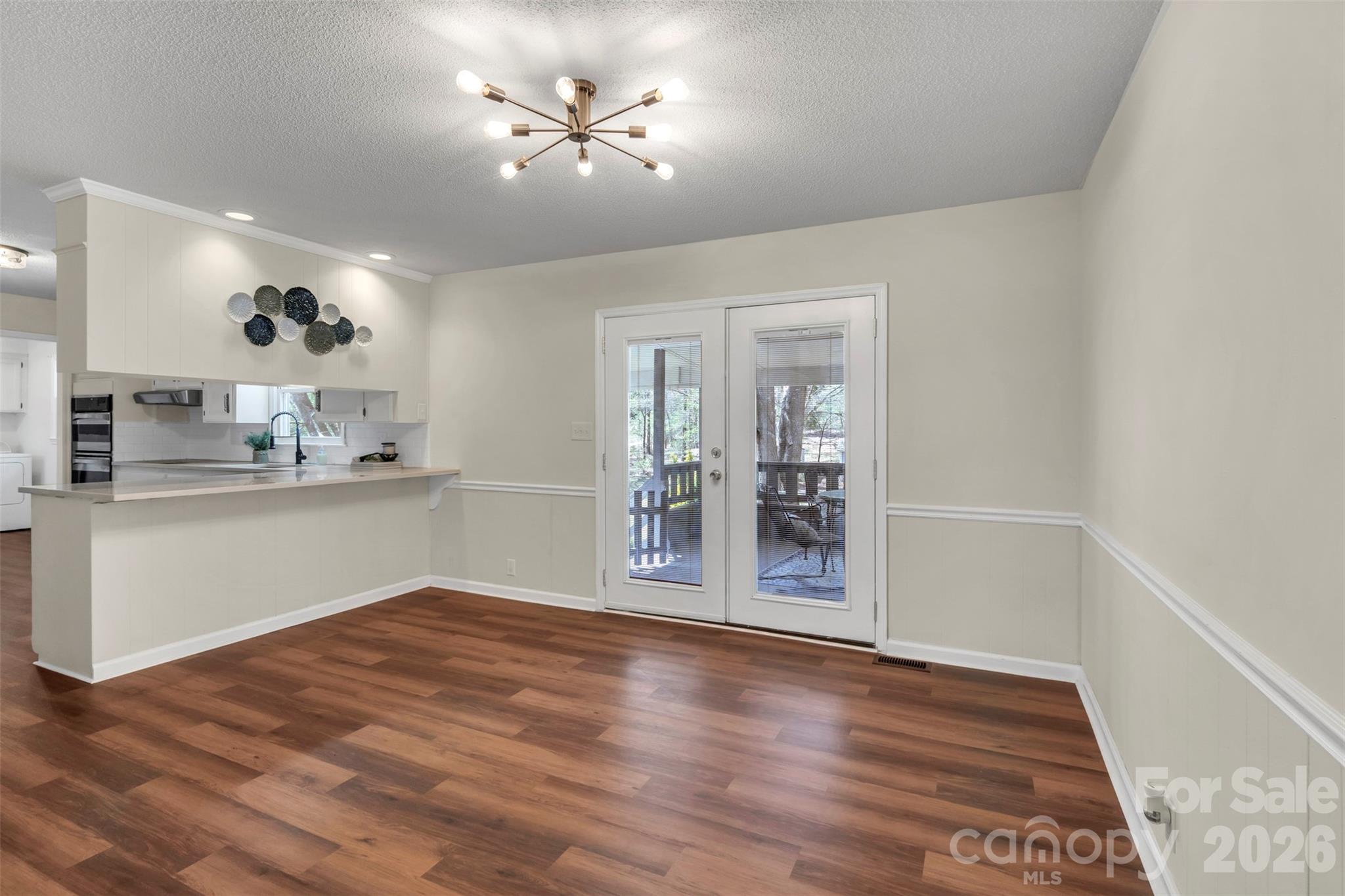 1471 Monroe Highway Lancaster, SC 29720 - Photo 16 of 45 a view of an empty room with kitchen and a window