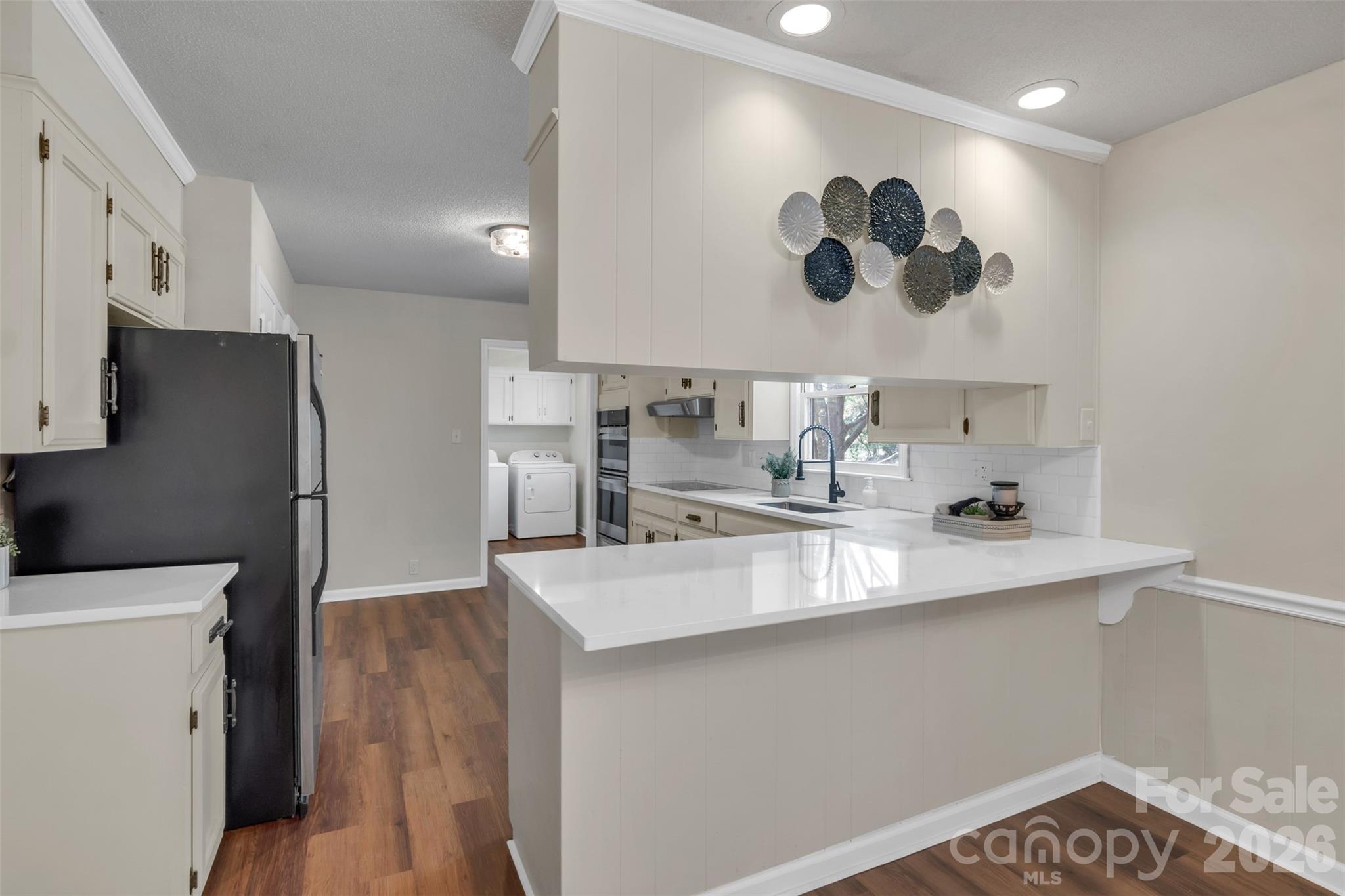 1471 Monroe Highway Lancaster, SC 29720 - Photo 17 of 45 a kitchen with stainless steel appliances a sink a stove and refrigerator