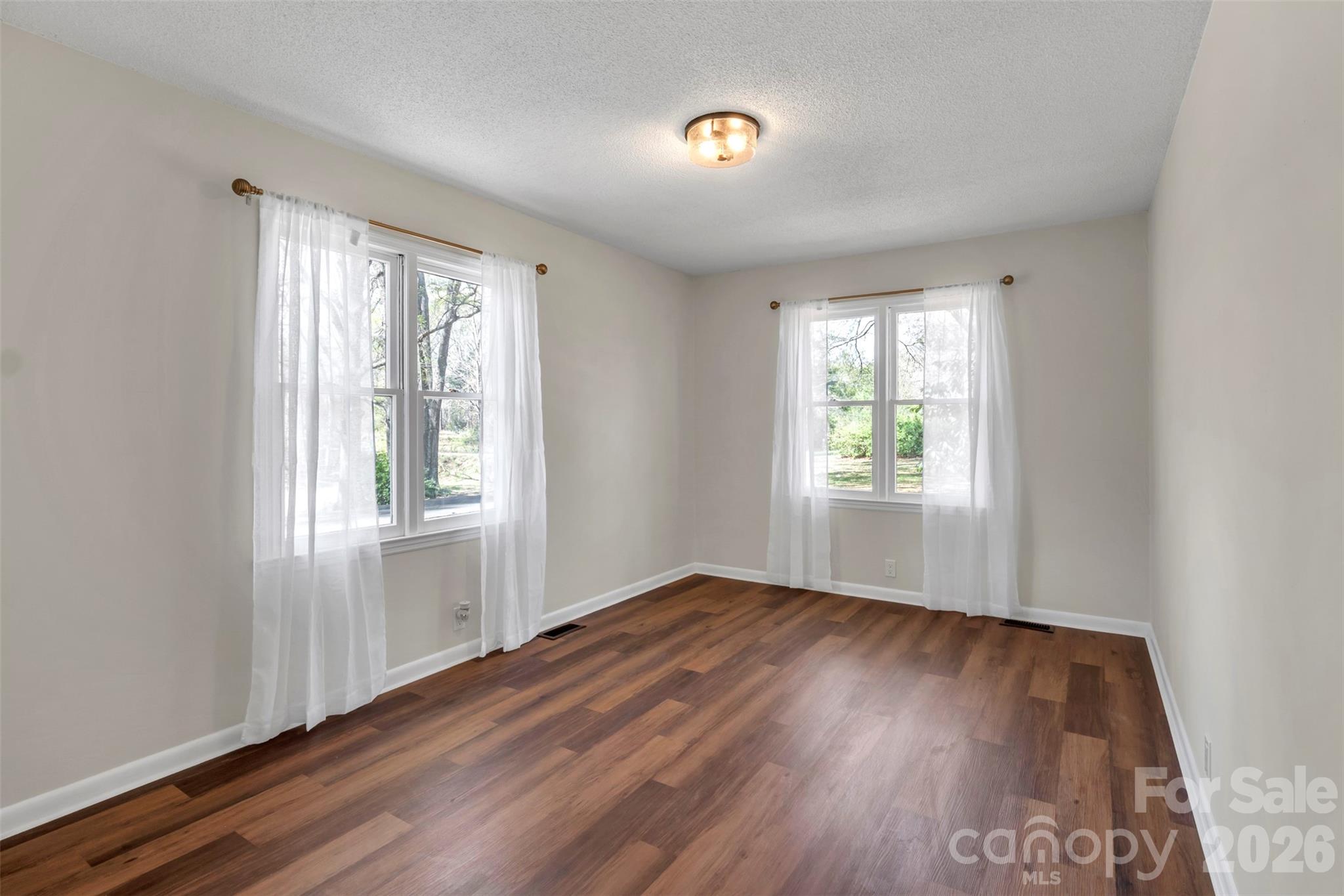 1471 Monroe Highway Lancaster, SC 29720 - Photo 30 of 45 an empty room with wooden floor and windows