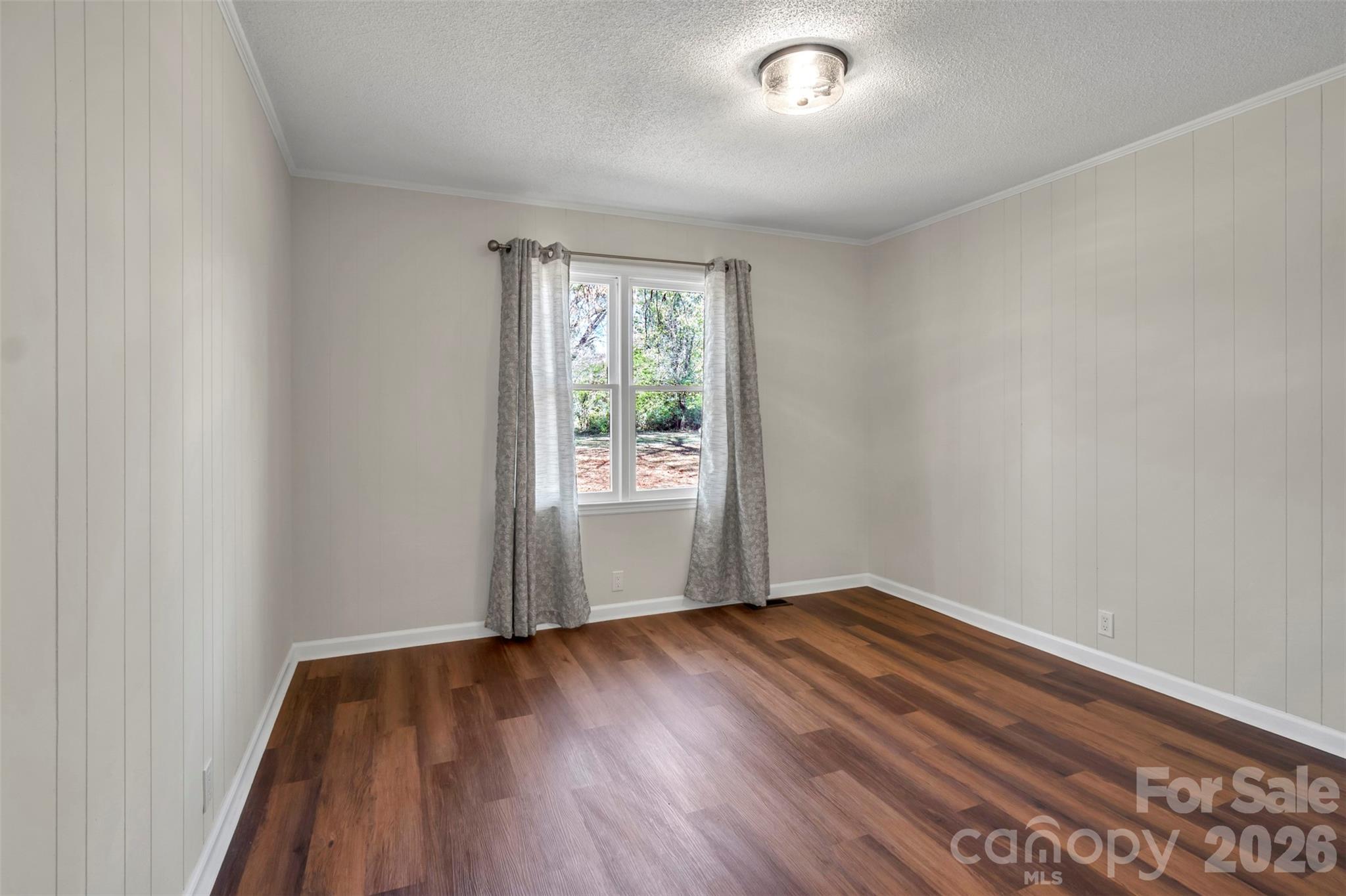 1471 Monroe Highway Lancaster, SC 29720 - Photo 33 of 45 an empty room with wooden floor and windows