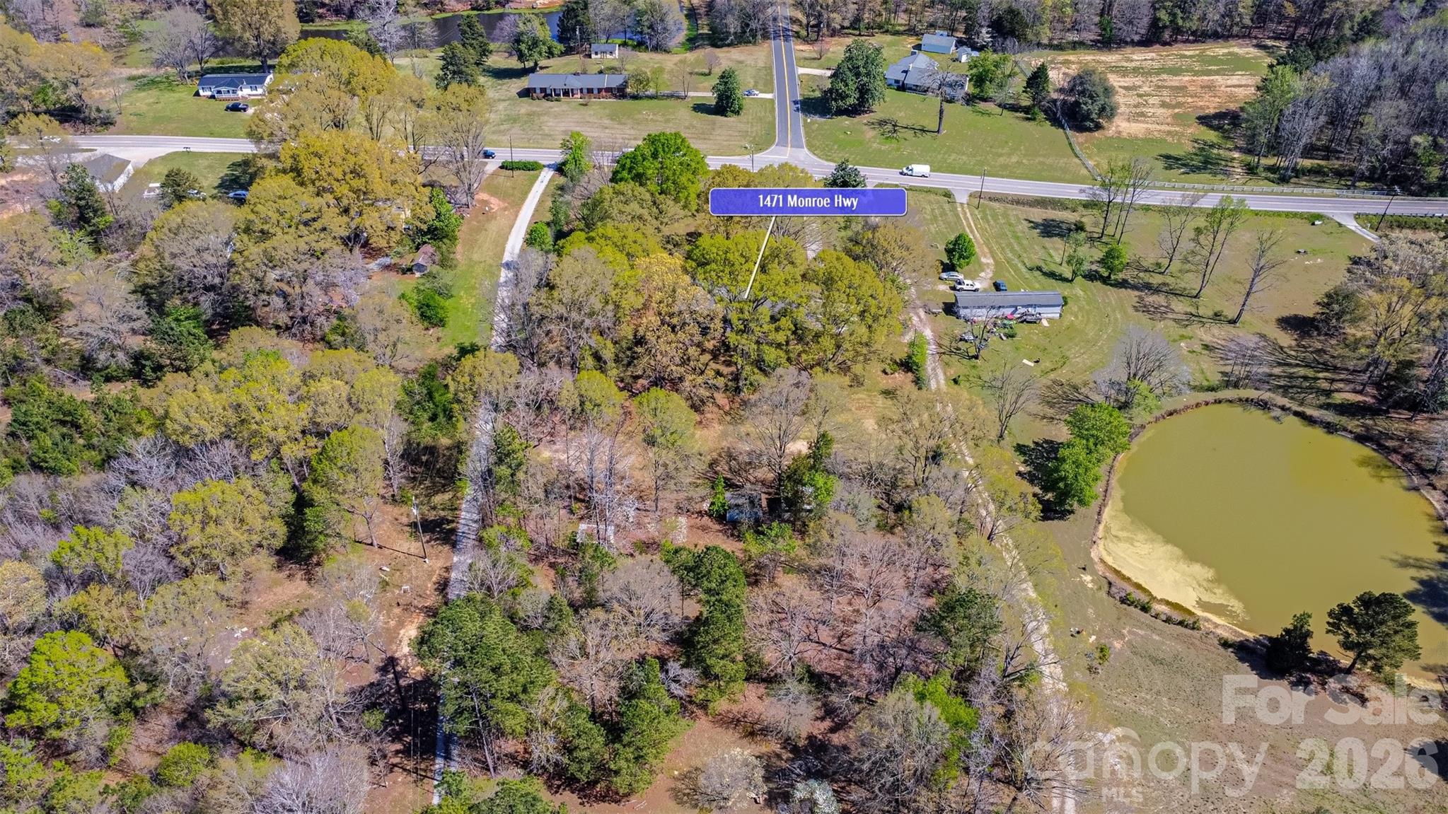 1471 Monroe Highway Lancaster, SC 29720 - Photo 41 of 45 a view of a swimming pool with a yard and trees in the background