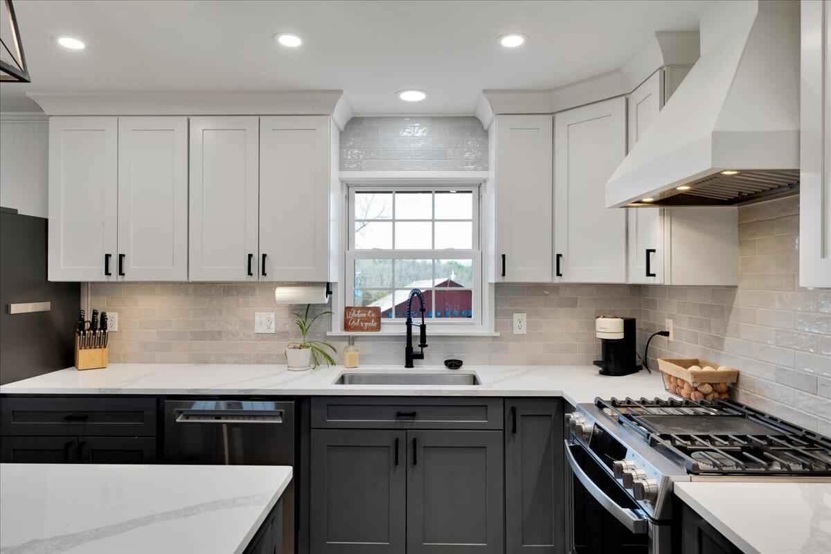 4660 Franklin Street Rocky Mount, VA 24151 - Photo 14 of 55 a kitchen with stainless steel appliances a sink stove and cabinets