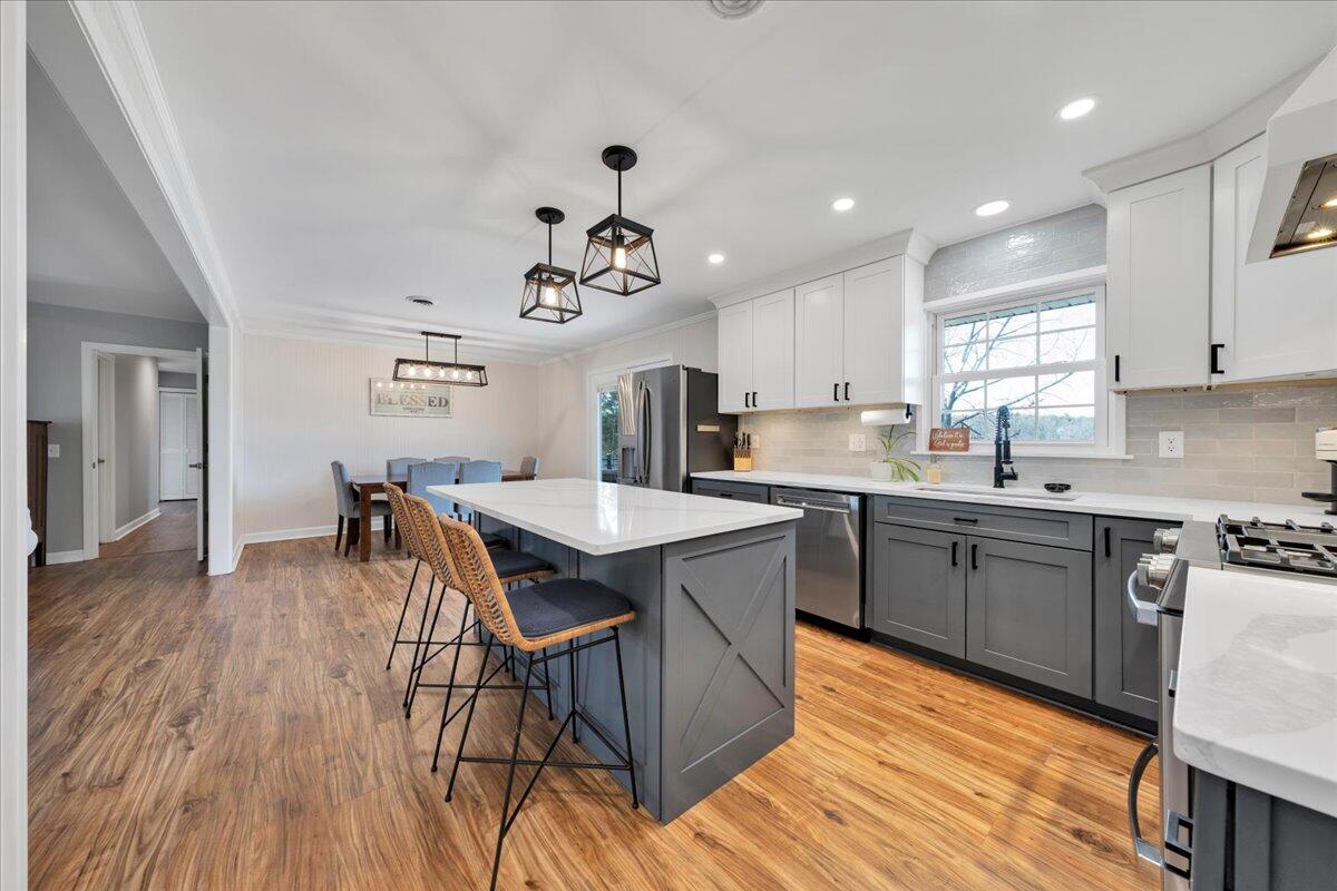 4660 Franklin Street Rocky Mount, VA 24151 - Photo 16 of 55 a kitchen with granite countertop white cabinets and stainless steel appliances