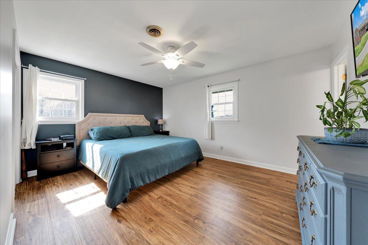 4660 Franklin Street Rocky Mount, VA 24151 - Photo 19 of 55 a bedroom with a bed and a potted plant on the dresser