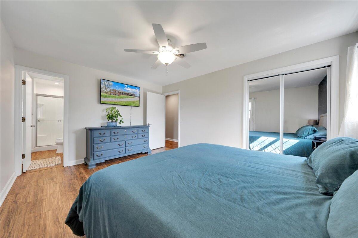4660 Franklin Street Rocky Mount, VA 24151 - Photo 20 of 55 a bedroom with a bed and a chandelier