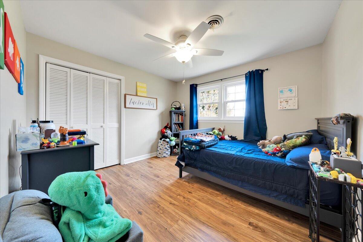 4660 Franklin Street Rocky Mount, VA 24151 - Photo 23 of 55 a bedroom with bed and a chandelier