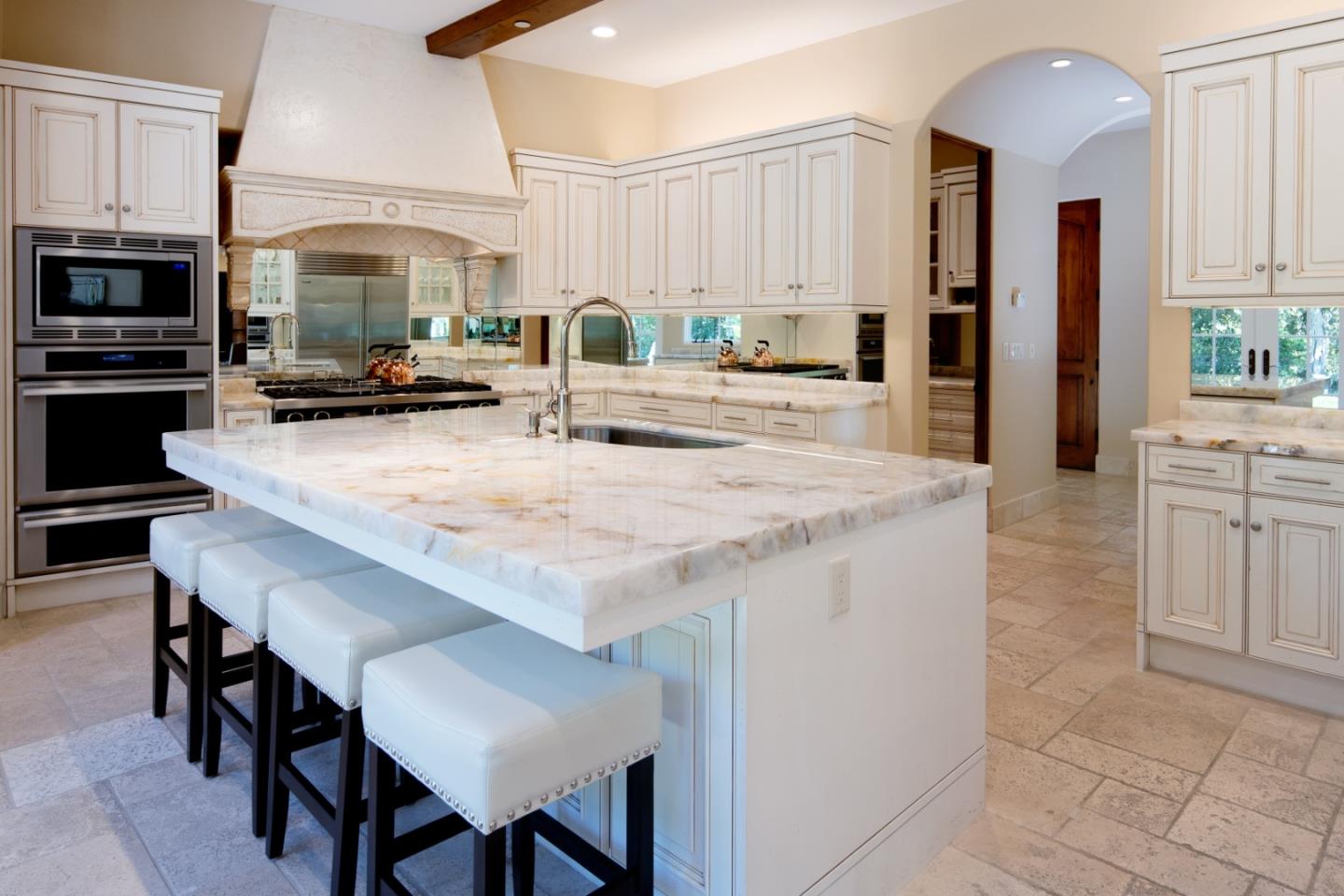 24316 Monterra Woods Monterey, CA 93940 - Photo 15 of 31 a large kitchen with granite countertop a stove and a sink