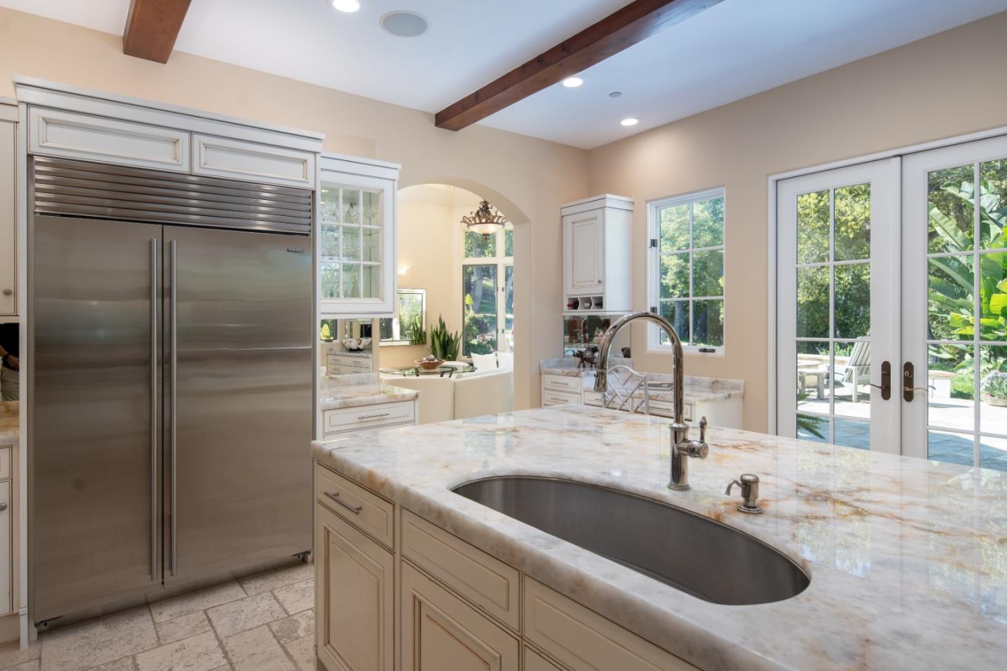 24316 Monterra Woods Monterey, CA 93940 - Photo 17 of 31 a kitchen with a refrigerator and windows