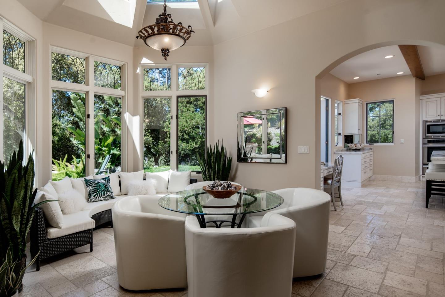 24316 Monterra Woods Monterey, CA 93940 - Photo 18 of 31 a living room with patio furniture and a chandelier