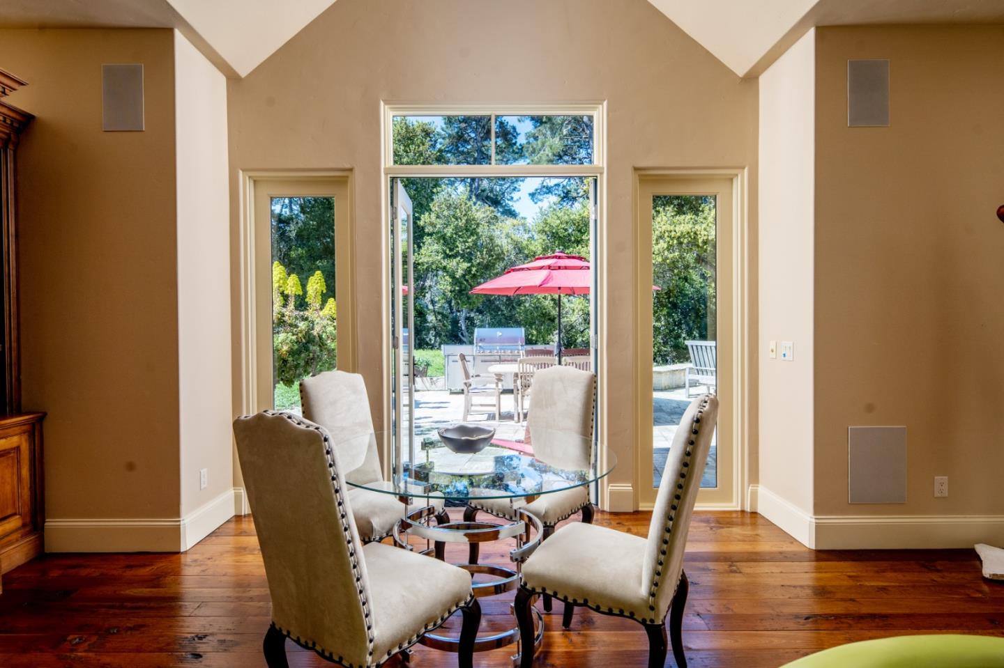 24316 Monterra Woods Monterey, CA 93940 - Photo 19 of 31 a view of a dining room with furniture window and wooden floor