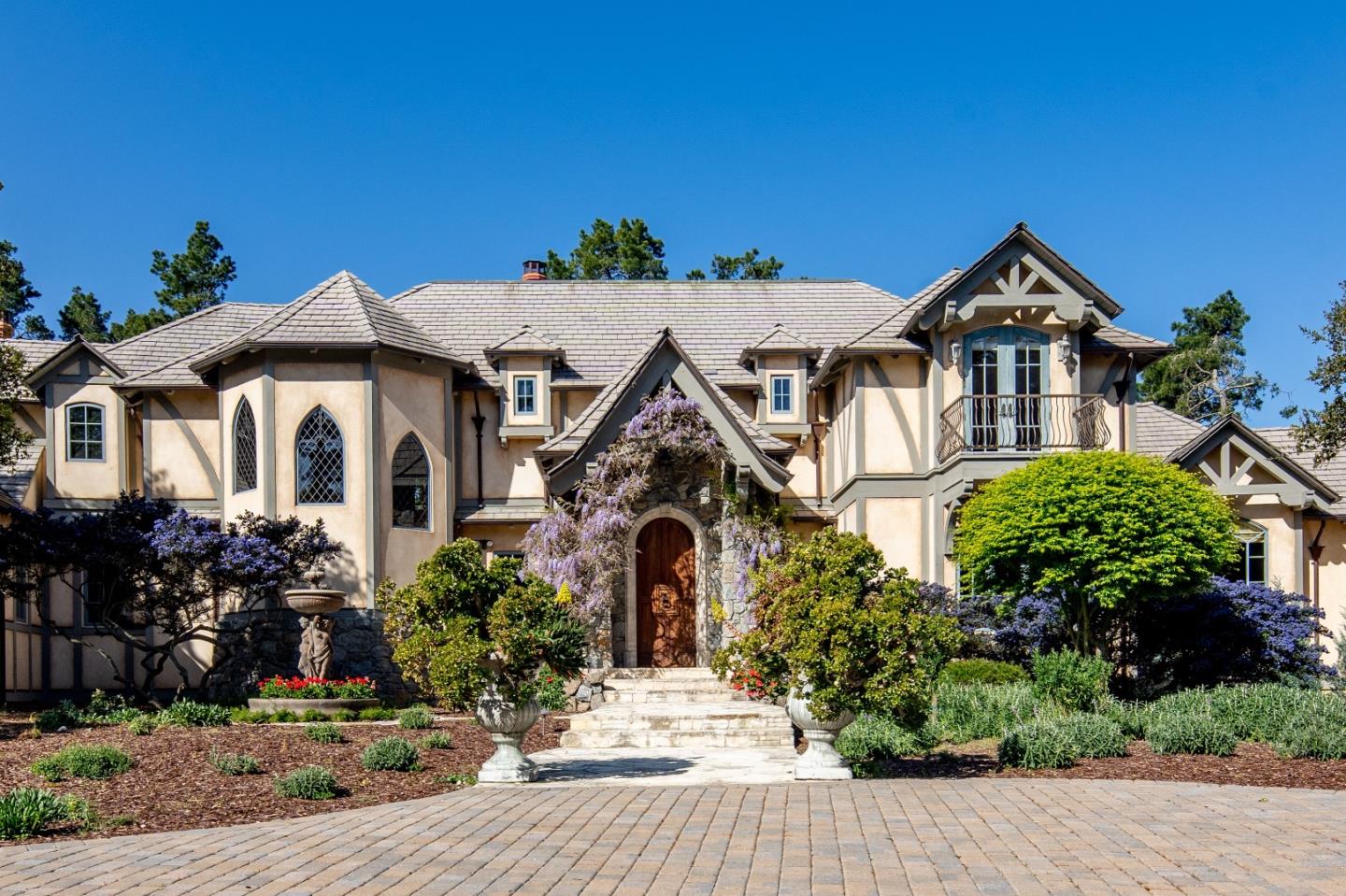 24316 Monterra Woods Monterey, CA 93940 - Photo 2 of 31 a front view of a house with a yard