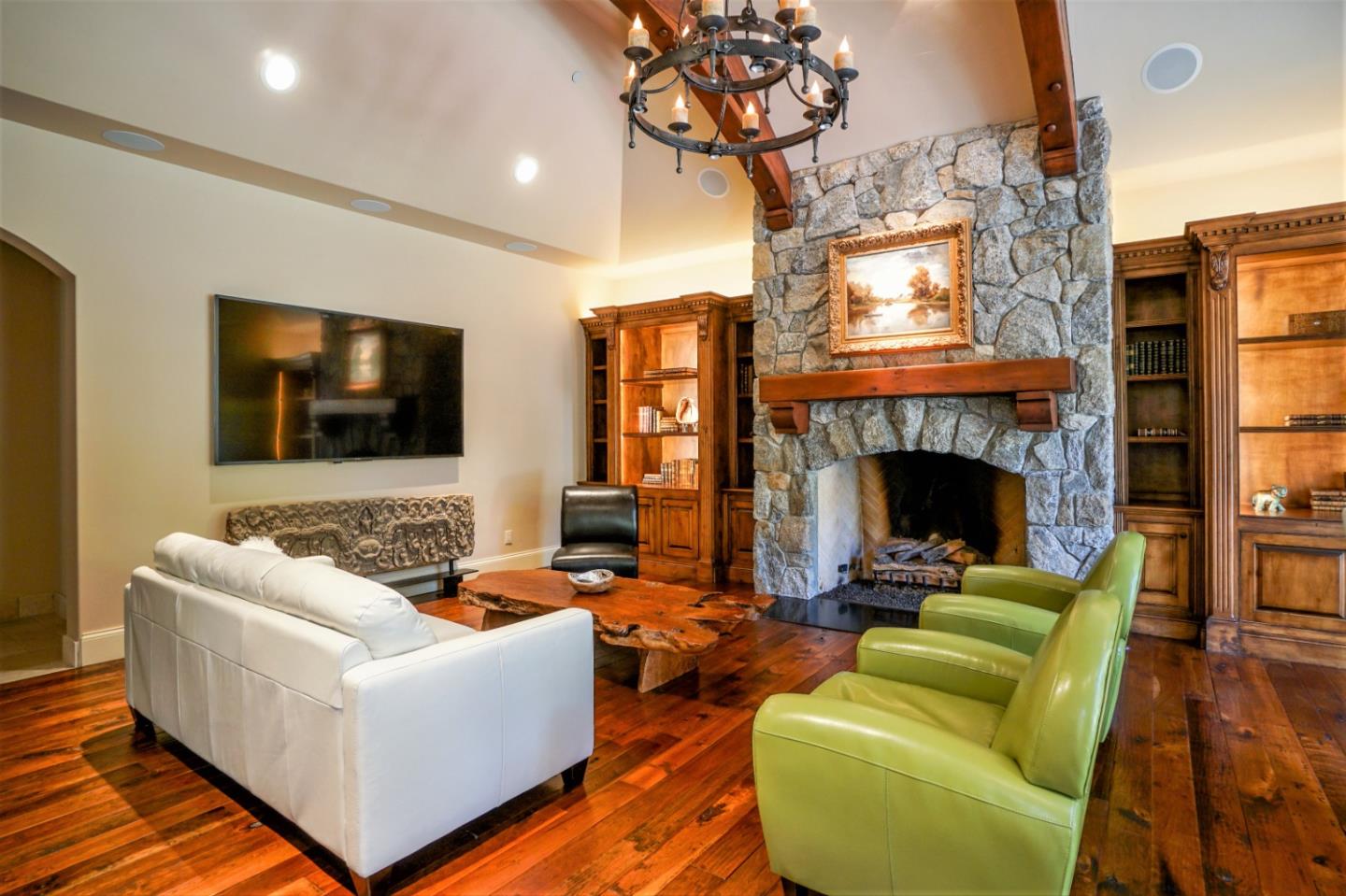 24316 Monterra Woods Monterey, CA 93940 - Photo 21 of 31 a living room with furniture a flat screen tv and a fireplace