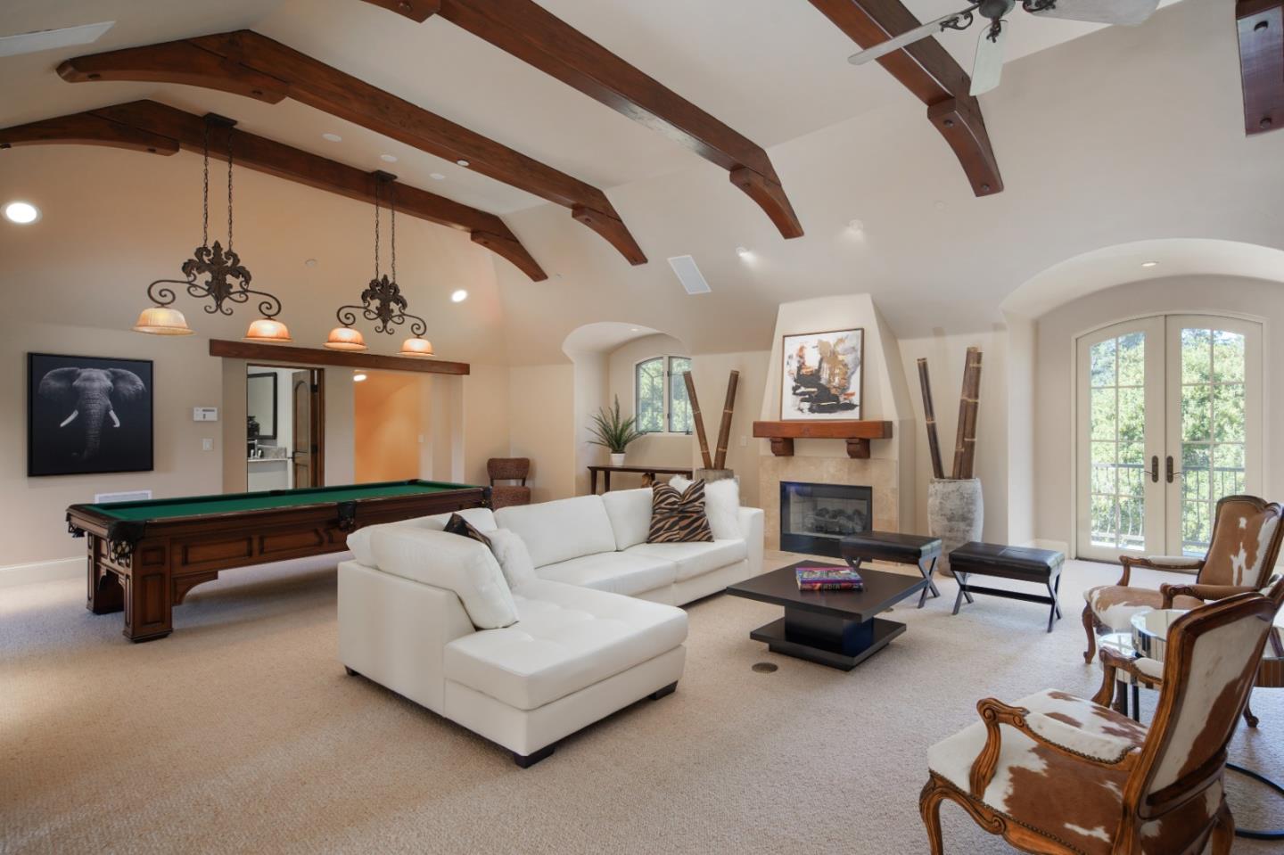 24316 Monterra Woods Monterey, CA 93940 - Photo 25 of 31 a living room with furniture a fireplace and large windows