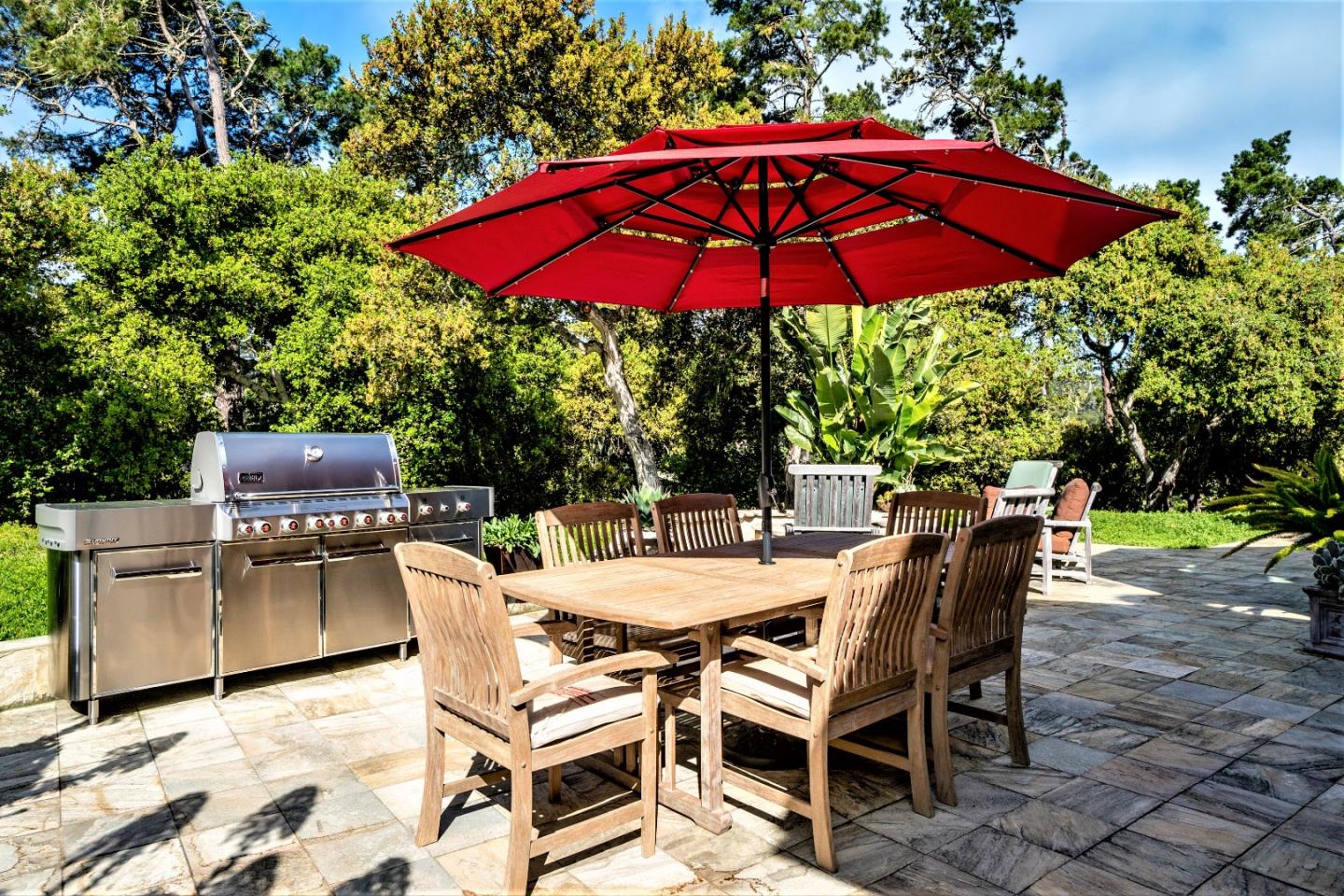 24316 Monterra Woods Monterey, CA 93940 - Photo 27 of 31 a patio with a patio table and chairs