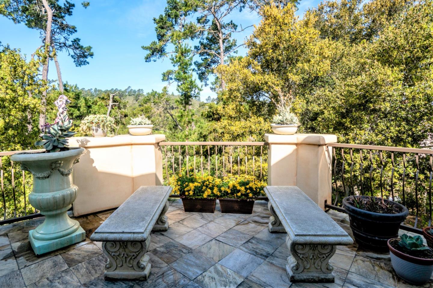 24316 Monterra Woods Monterey, CA 93940 - Photo 29 of 31 a view of a balcony with chairs potted plants