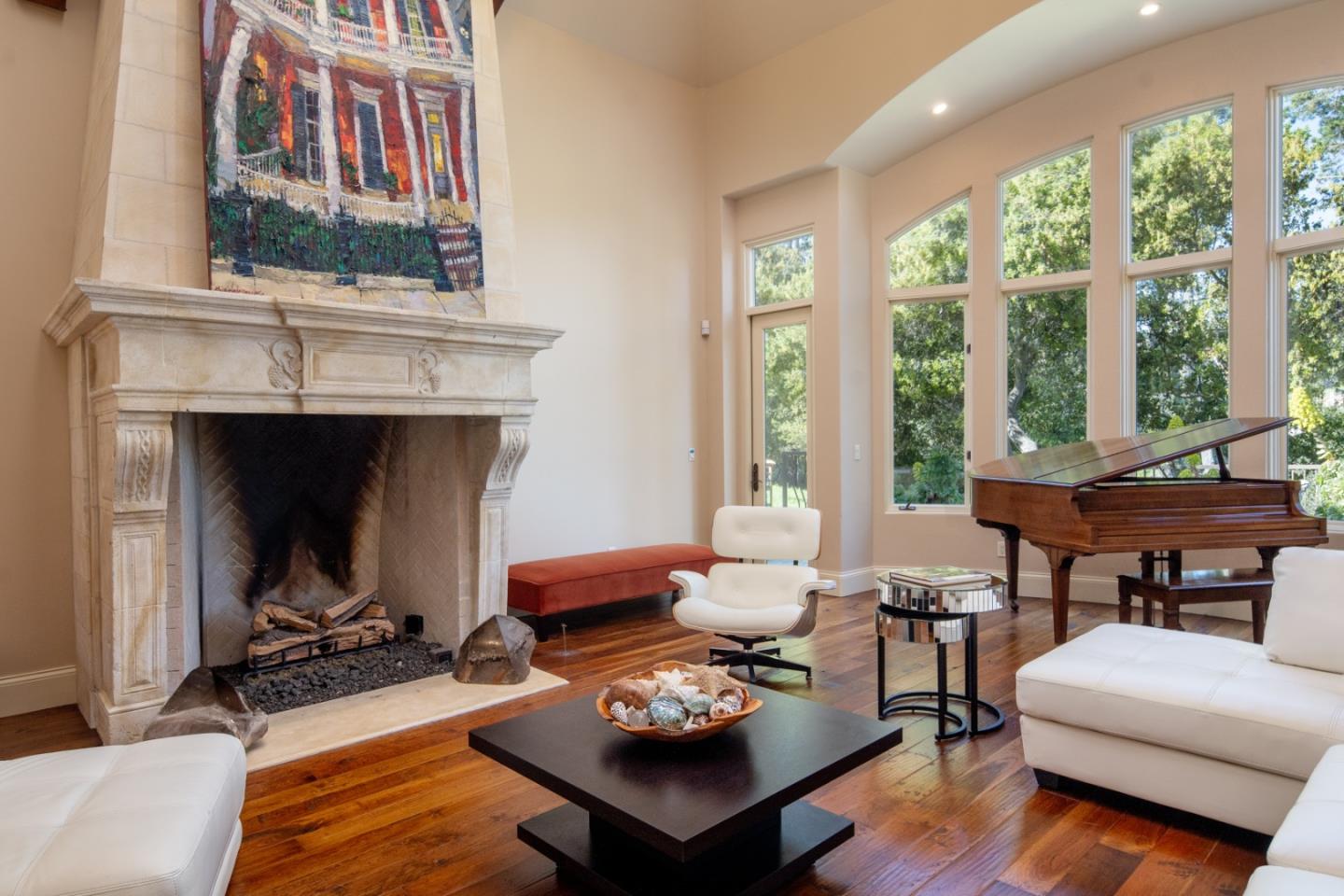 24316 Monterra Woods Monterey, CA 93940 - Photo 6 of 31 a living room with furniture a fireplace and a floor to ceiling window