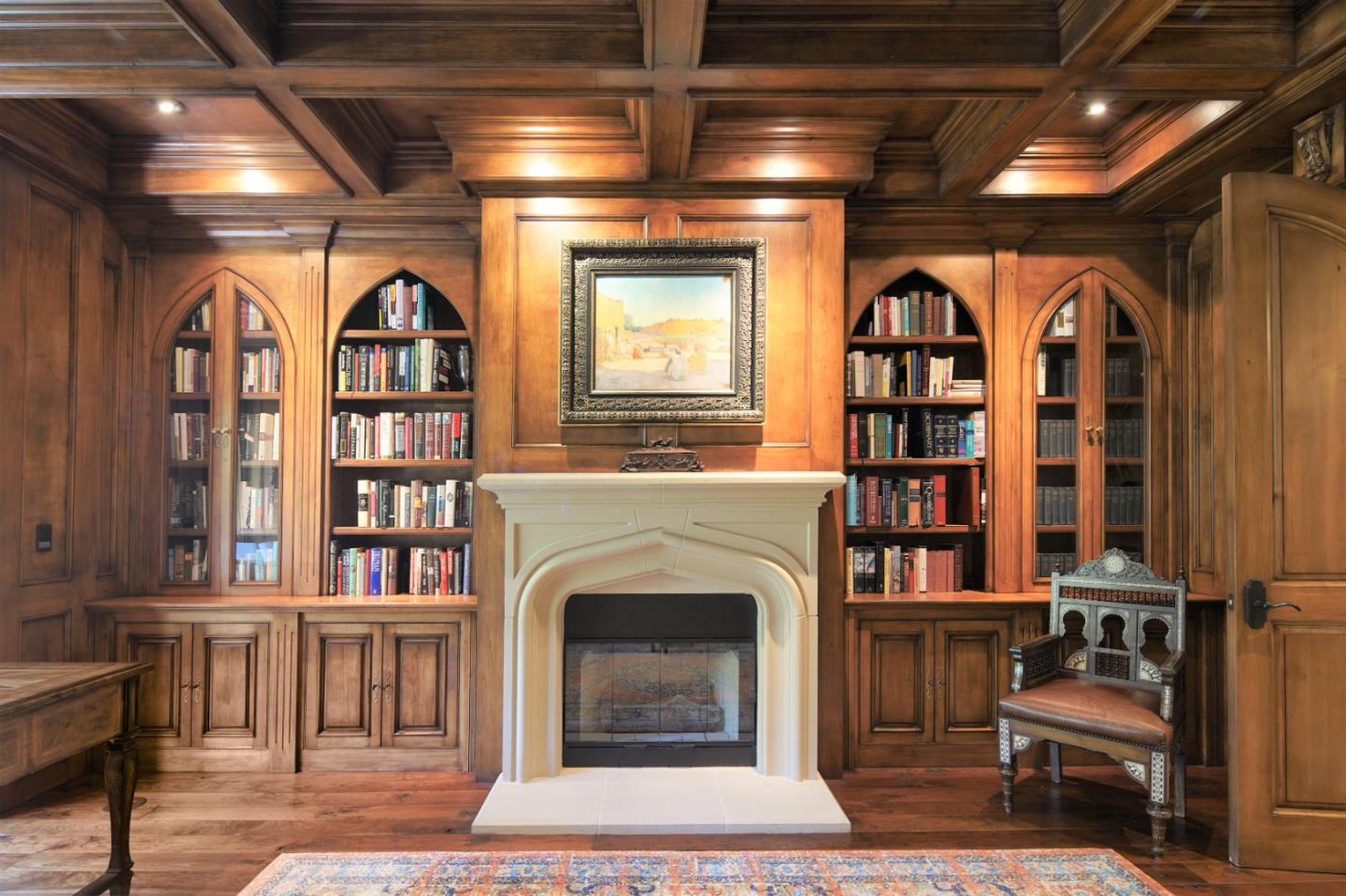 24316 Monterra Woods Monterey, CA 93940 - Photo 8 of 31 a living room with furniture a fireplace and a book shelf