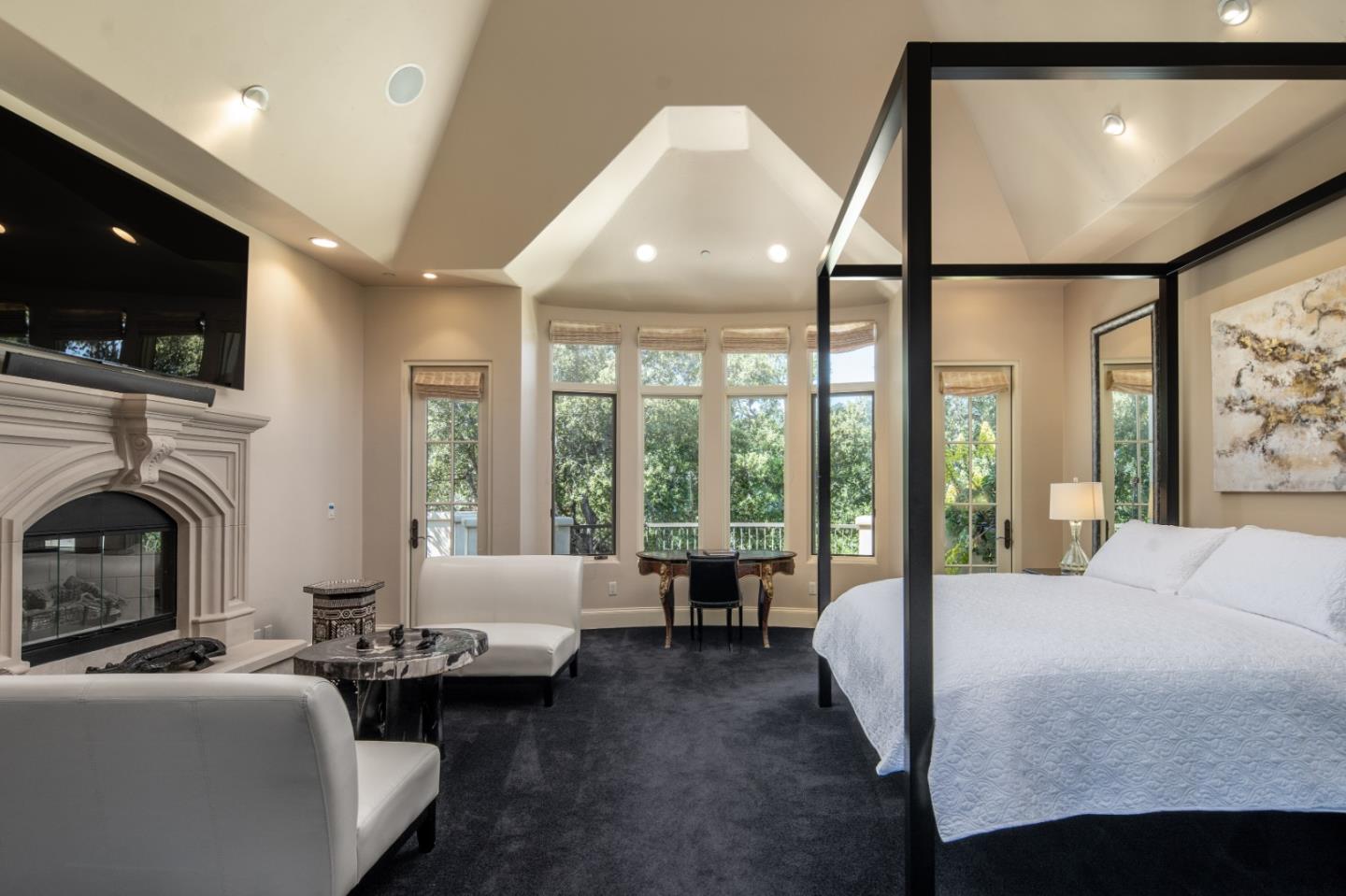 24316 Monterra Woods Monterey, CA 93940 - Photo 10 of 31 a living room with furniture a fireplace and a flat screen tv