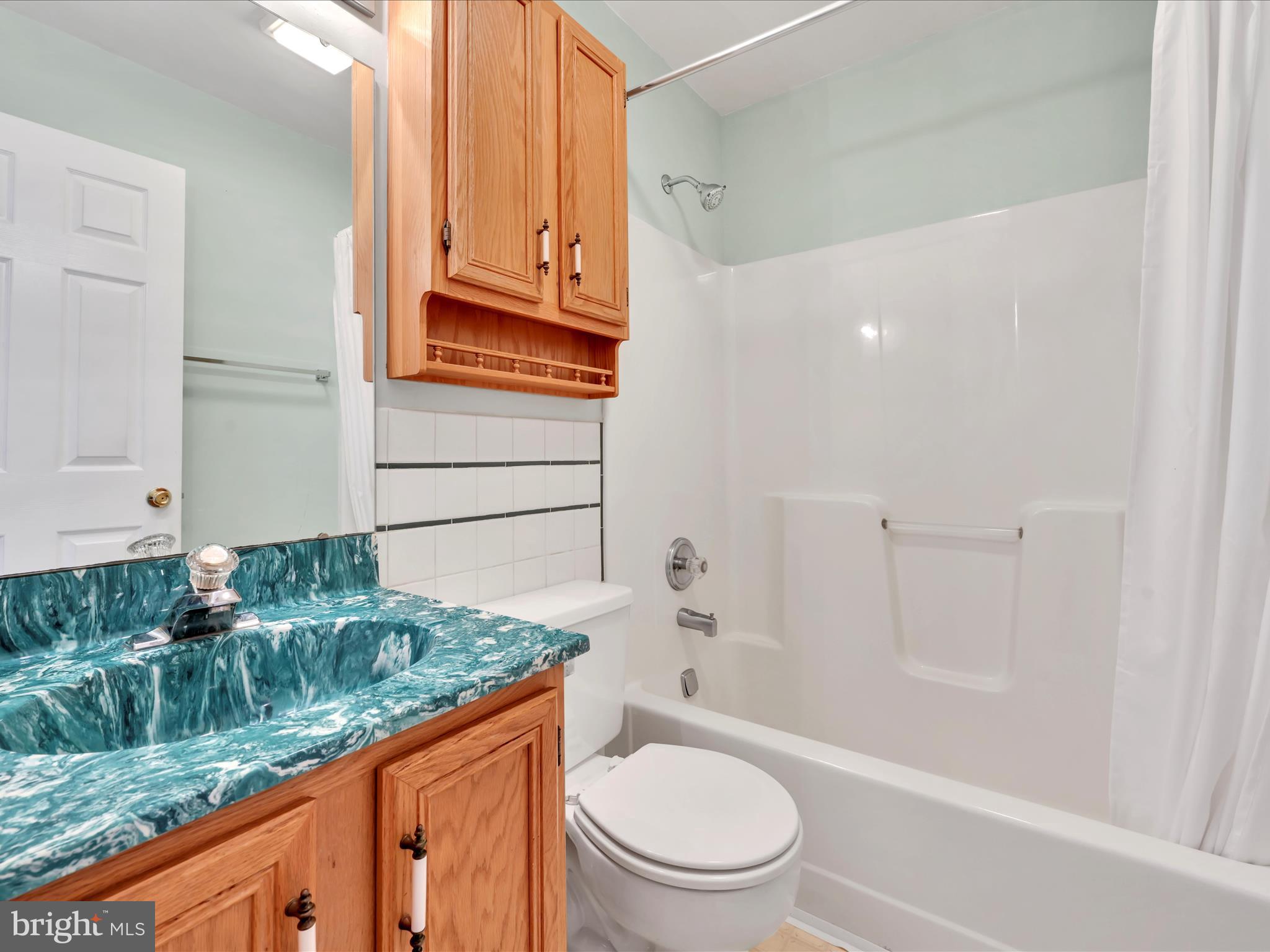 95 Comanche Drive Auburn, PA 17922 - Photo 22 of 33 a bathroom with a granite countertop sink a toilet and bathtub