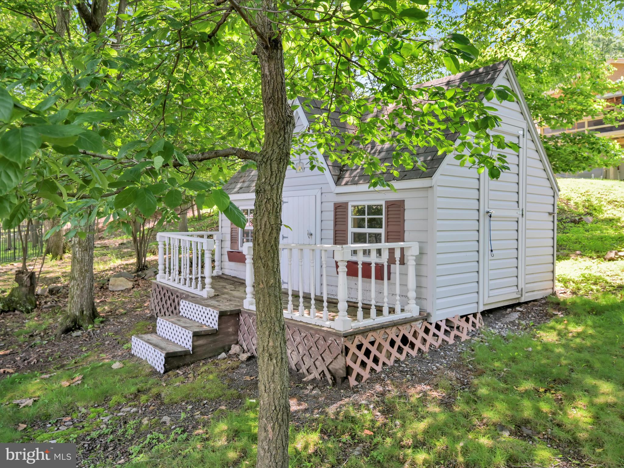 95 Comanche Drive Auburn, PA 17922 - Photo 6 of 33 a view of a house with a small yard and wooden fence