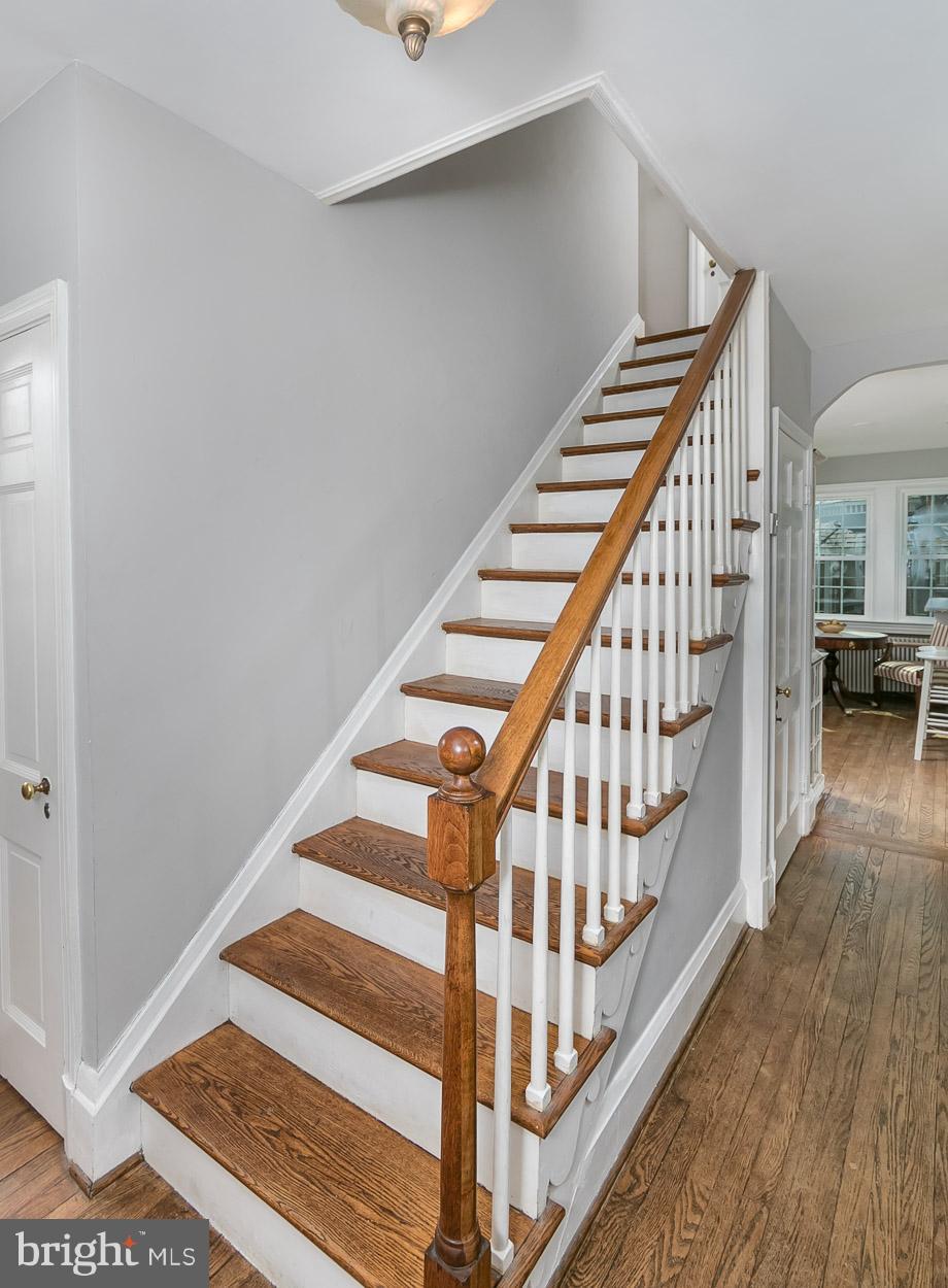 513 Wilton Road Baltimore, MD 21286 - Photo 17 of 30 a view of staircase with wooden floor and white walls