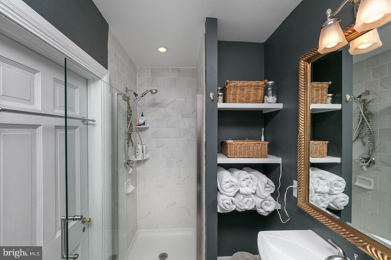 513 Wilton Road Baltimore, MD 21286 - Photo 22 of 30 a bathroom with a sink toilet and shower