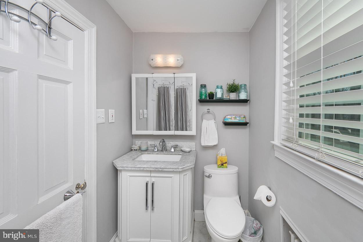 513 Wilton Road Baltimore, MD 21286 - Photo 25 of 30 a bathroom with a sink toilet and shower