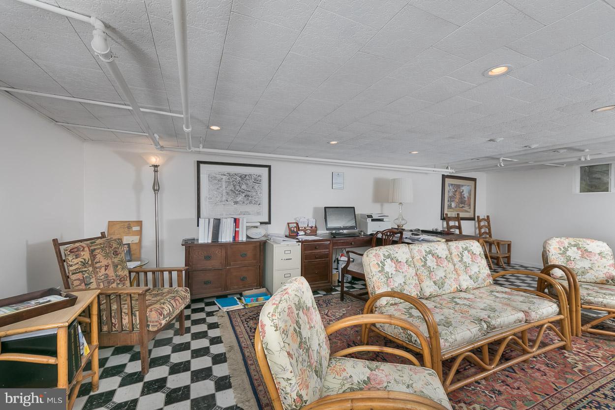 513 Wilton Road Baltimore, MD 21286 - Photo 27 of 30 a living room with furniture and wooden floor