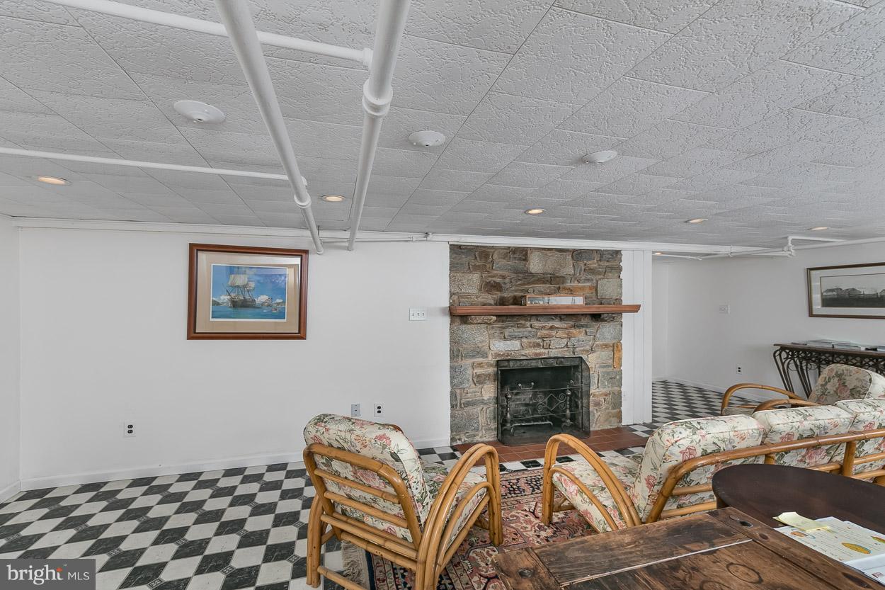 513 Wilton Road Baltimore, MD 21286 - Photo 29 of 30 a bedroom with furniture and a fireplace