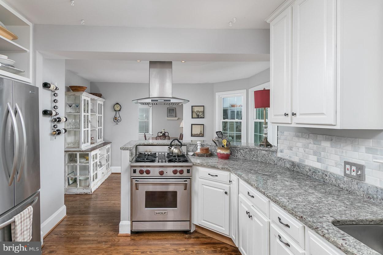 513 Wilton Road Baltimore, MD 21286 - Photo 9 of 30 a kitchen with stainless steel appliances granite countertop a stove a sink and a refrigerator