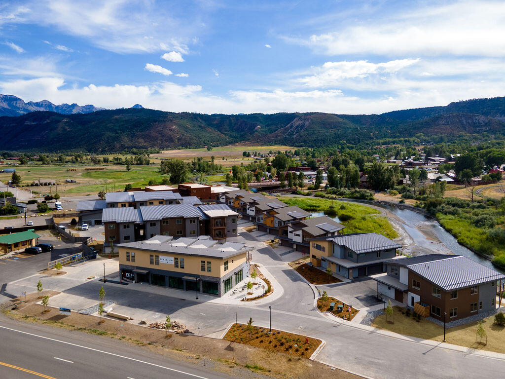 a view of a swimming pool and lounge chairs