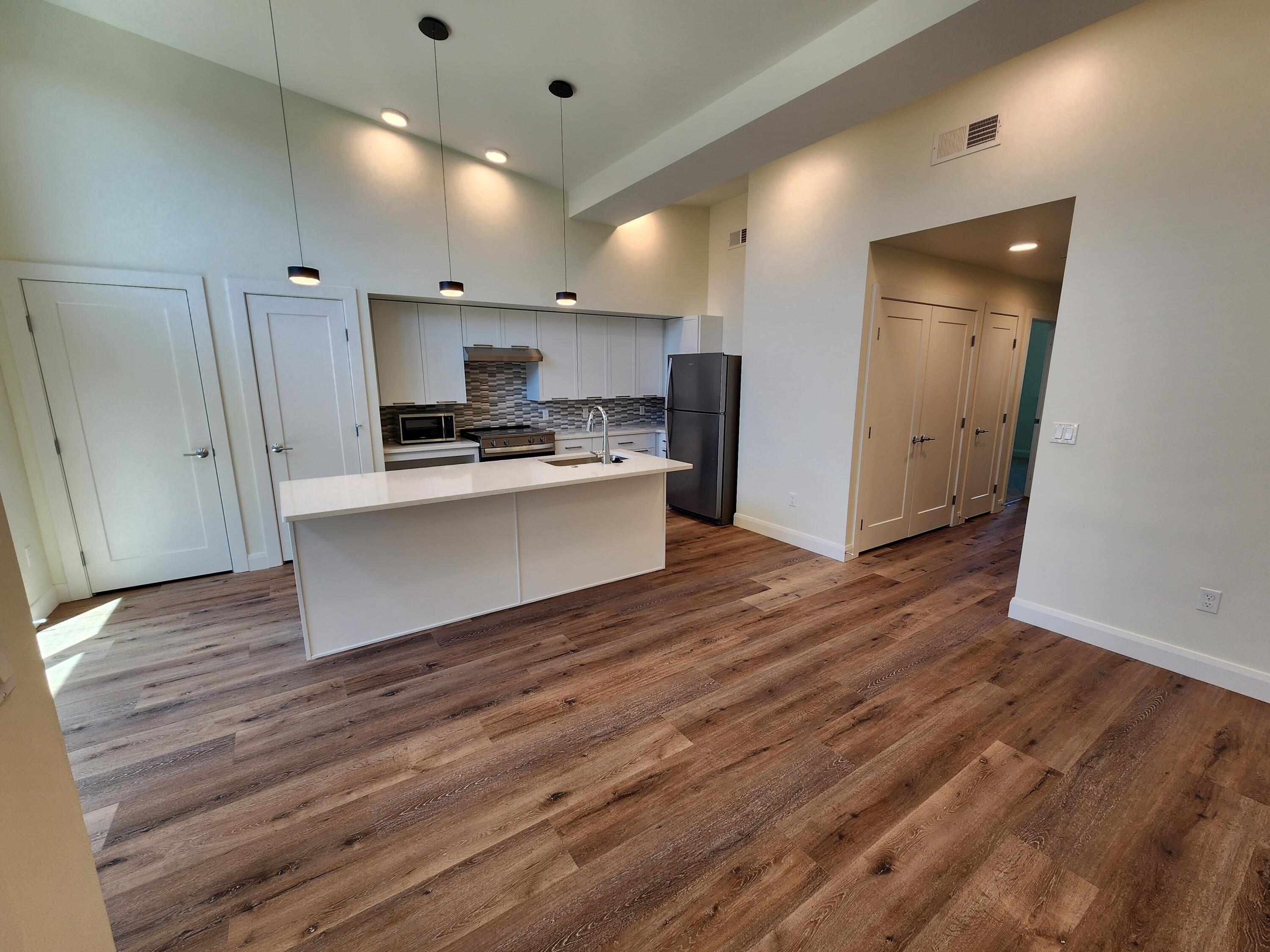 205 Jasper Place, Unit 203 Ridgway, CO 81432 - Photo 12 of 17 a view of kitchen with sink microwave and refrigerator