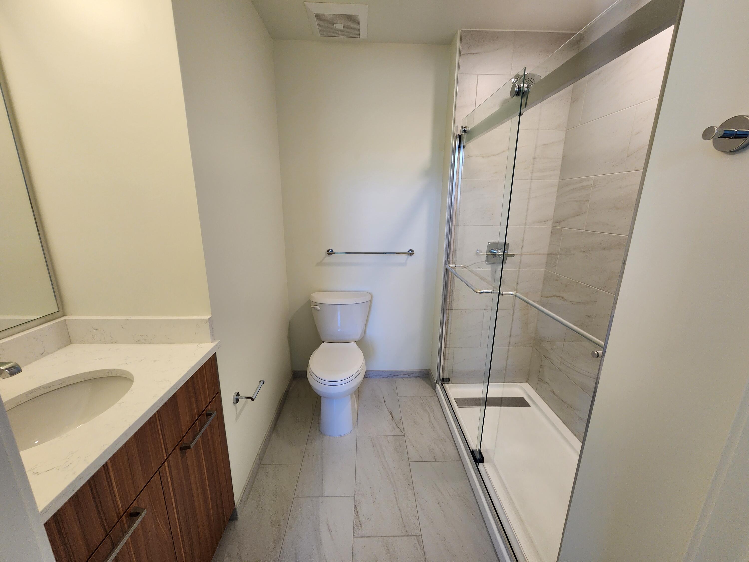 205 Jasper Place, Unit 203 Ridgway, CO 81432 - Photo 14 of 17 a bathroom with a sink a toilet and shower