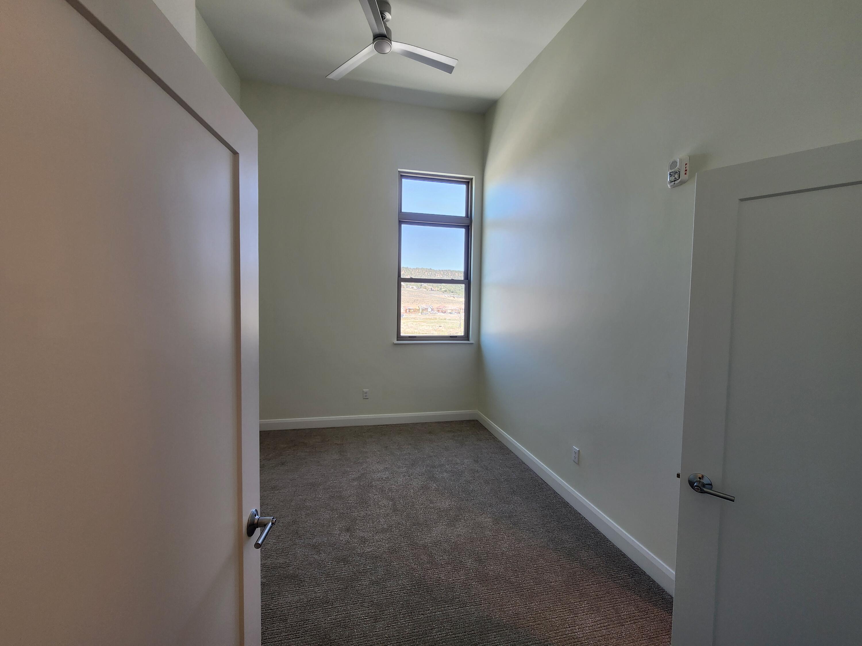 205 Jasper Place, Unit 203 Ridgway, CO 81432 - Photo 15 of 17 an empty room that has a window