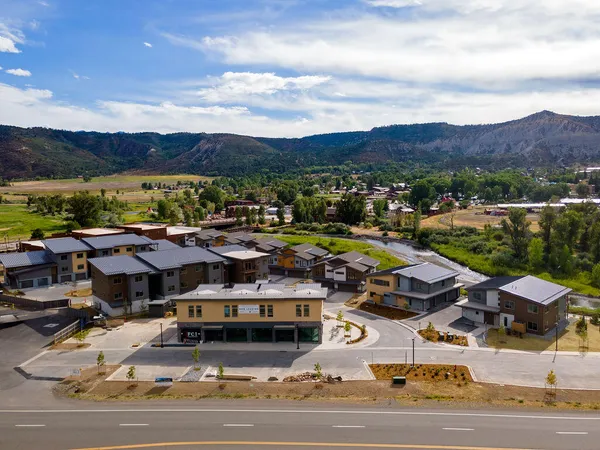 a view of multiple houses with outdoor space