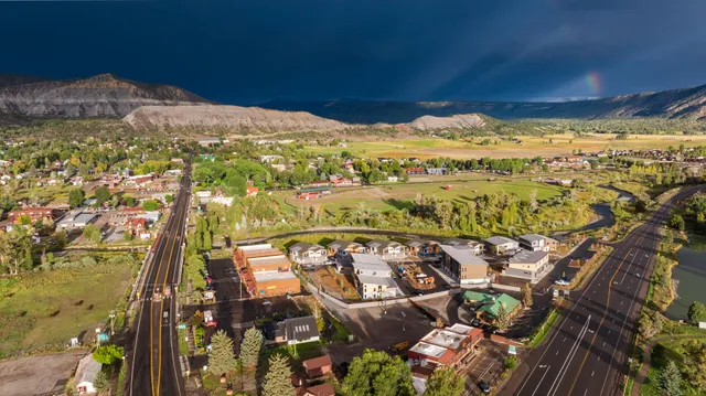 an aerial view of residential houses with outdoor space