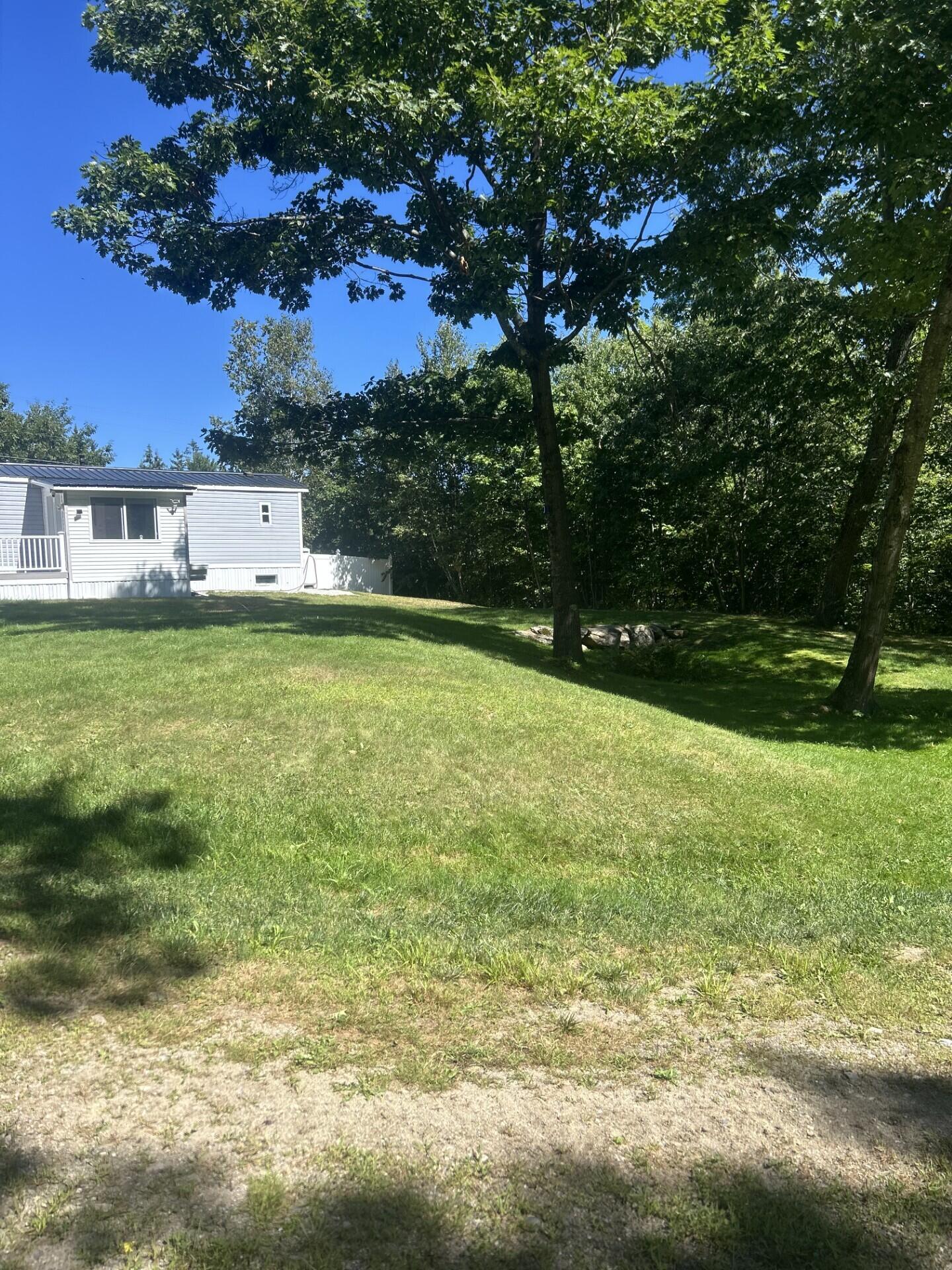 465 Fayette Road Livermore Falls, ME 04254 - Photo 3 of 35 0423 rear exterior yard