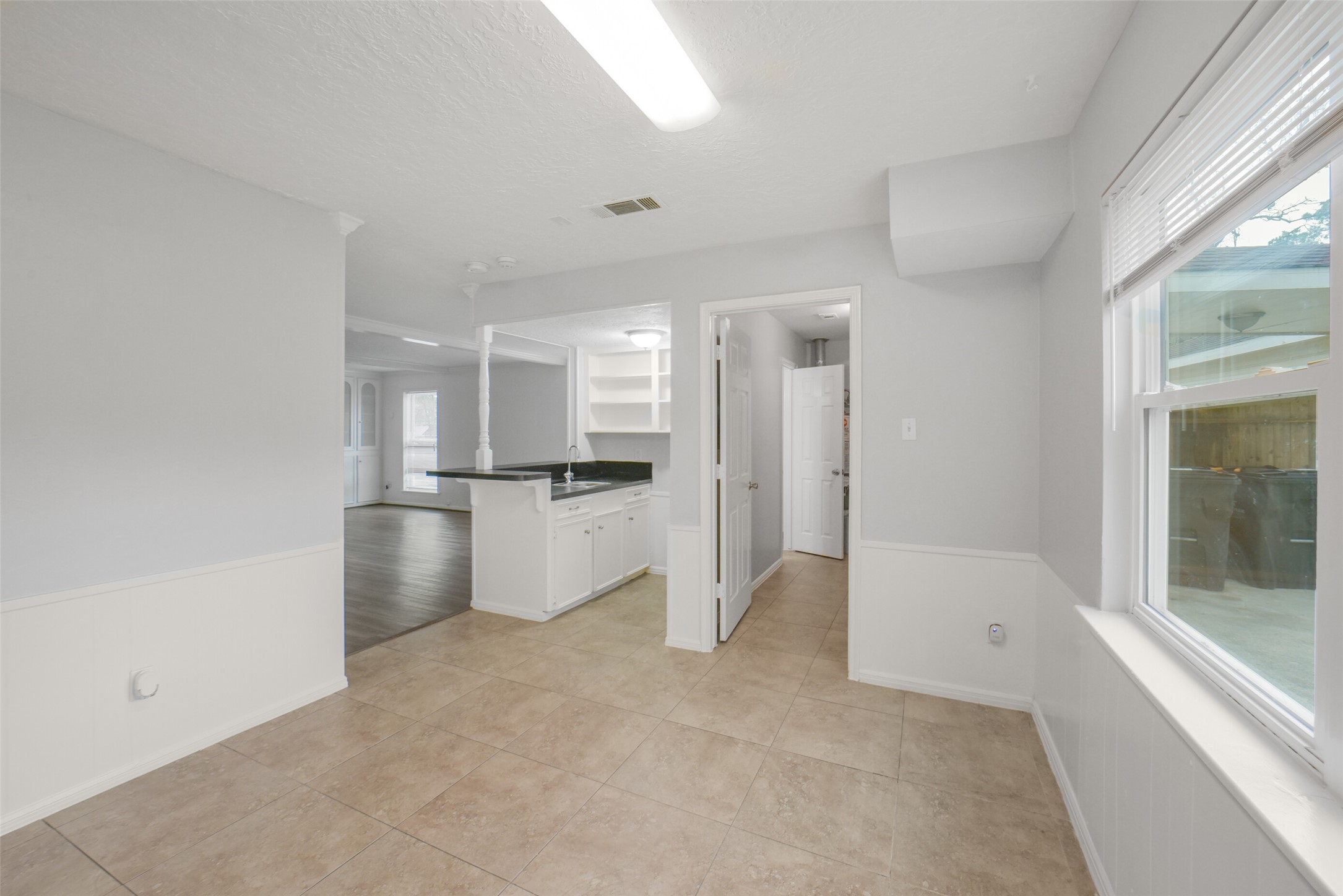 7611 Theisswood Road Spring, TX 77379 - Photo 16 of 41 a view of kitchen with refrigerator and window