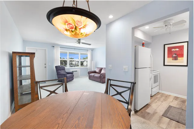 a view of a livingroom with furniture and a window